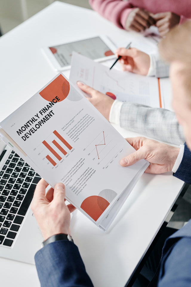 Business broker analyzing profitability, market position, and valuation for Singapore business sale.